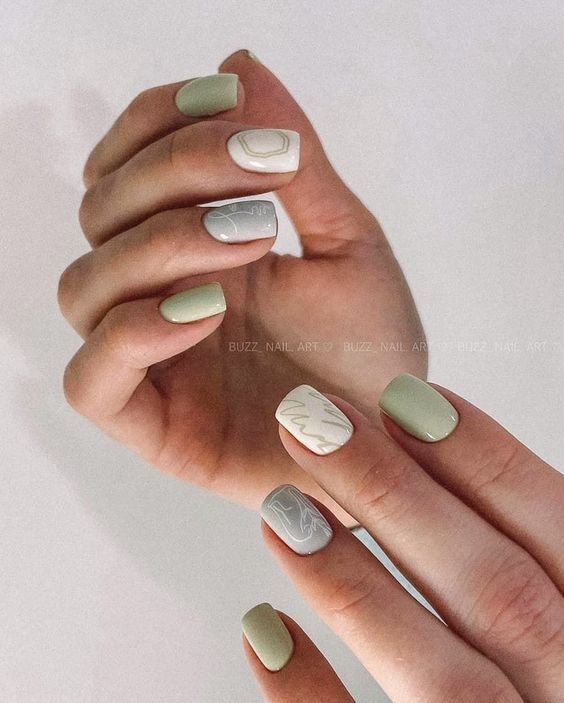 short green nails with white accent nail